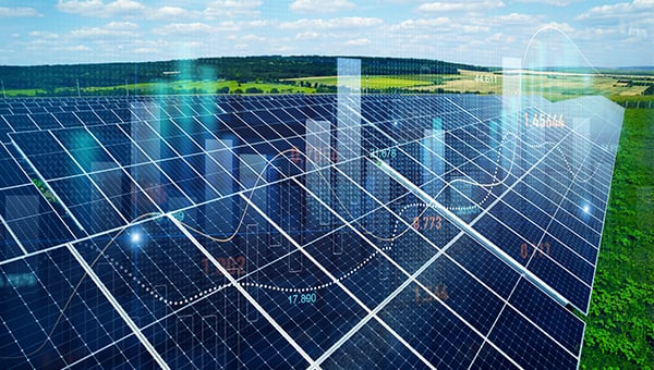 Large solar panel array in a rural landscape with overlaid data visualizations, including charts and graphs, representing energy production and analytics.