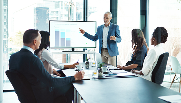 Business people viewing a presentation in a conference room